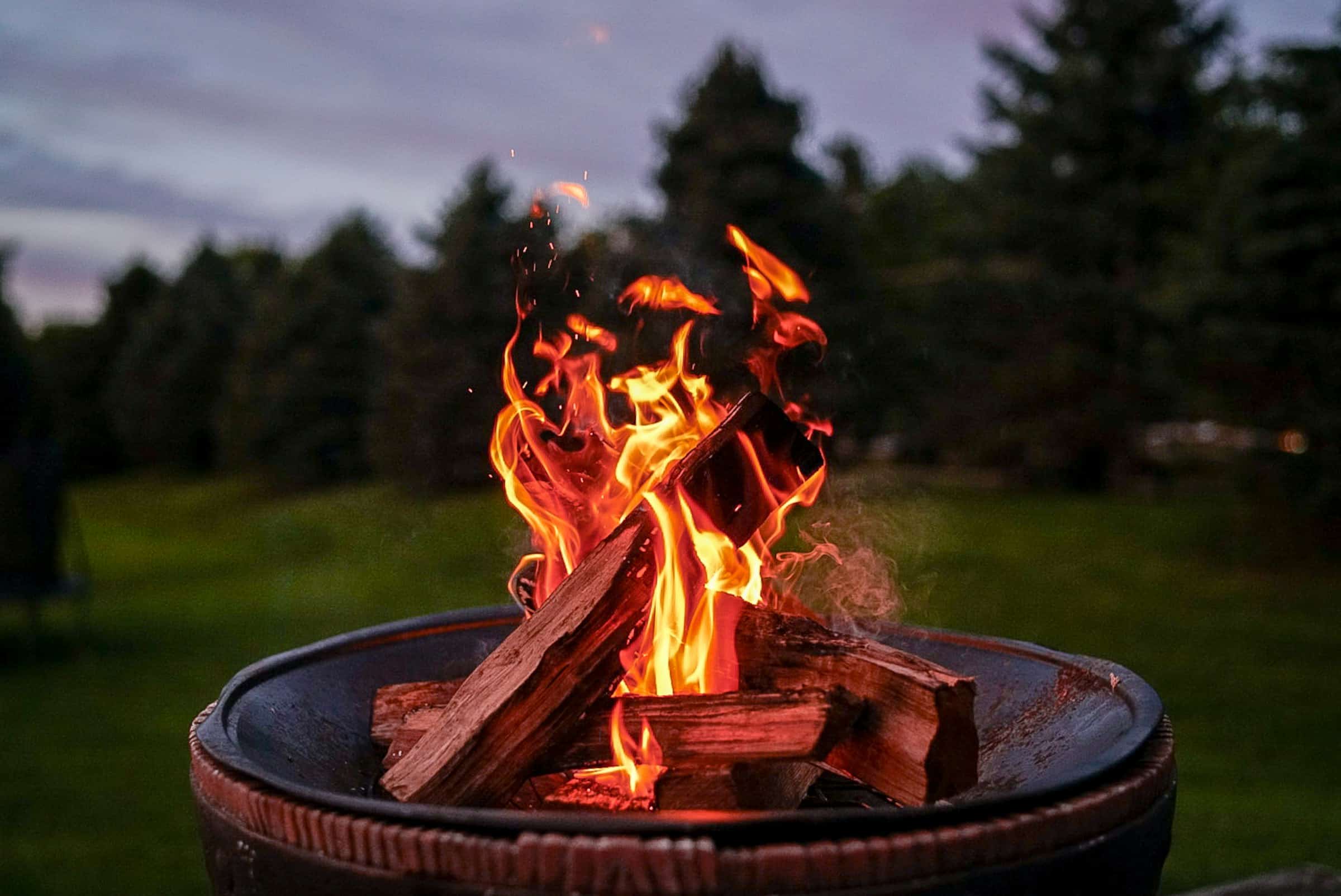 Fire burning in a fire pit at dusk